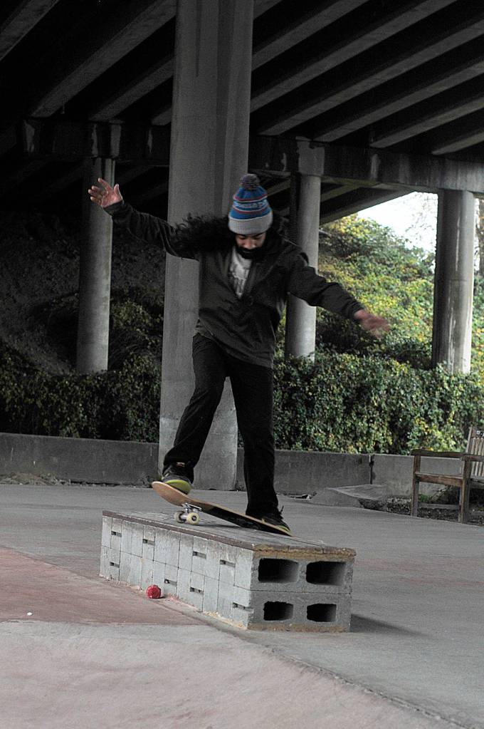 Eddie Santos traveled from Des Moines to skate at the Longacres Skatepark on a rainy Tuesday morning. Santos said Longacres is the only local covered skatepark in the region thats free to the public. (Leah Abraham | Renton Reporter)