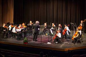 Renton Youth Symphony Orchestra with director Alexei Girsh rehearses on stage. (Courtesy image)