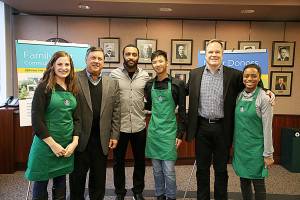 From left, Samantha Shockly of Starbucks, Renton Mayor Denis Law, Seahawks player Doug Baldwin, Alan Le Nguyen of Starbucks, John Kelly, senior vice president for Starbucks Global Public Affairs and Social Impact and Alexis Daniels of Starbucks. The group posed for a photo after the Family First Community Center received a $150,000 grant from The Starbucks Foundation this week. (Courtesy photo)