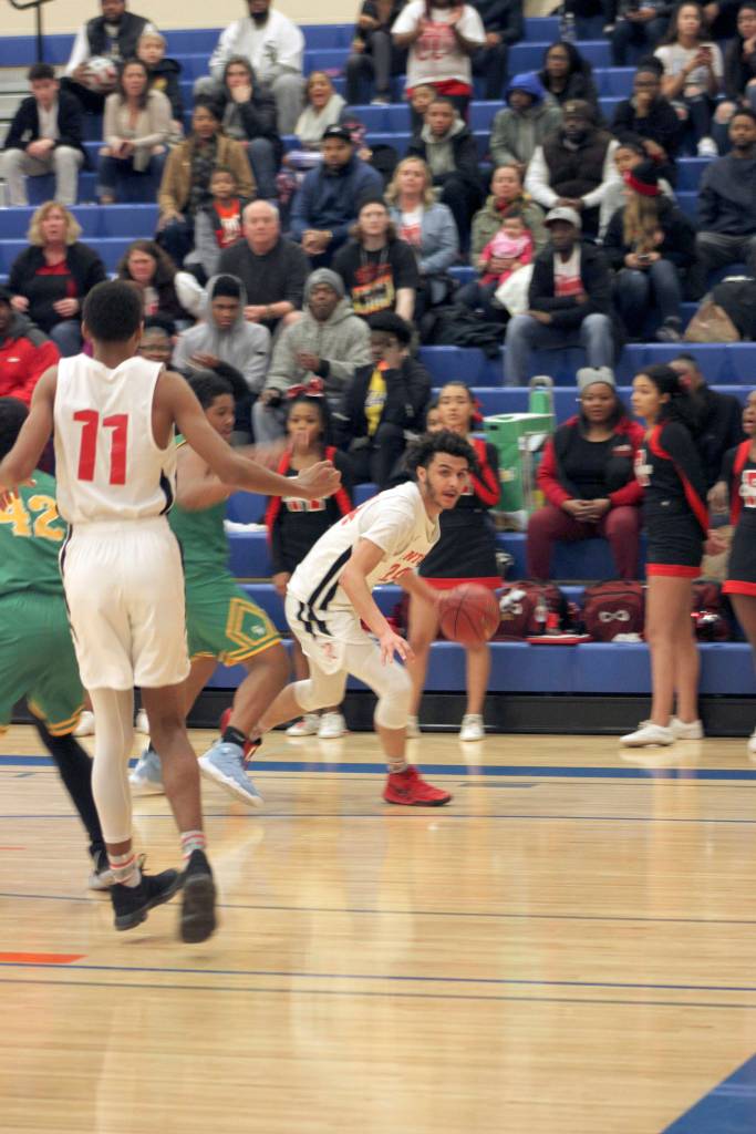 The Renton Indians boys basketball team beat Clover Park 58-49 Feb. 23 in regionals. Photos by Sarah Brenden