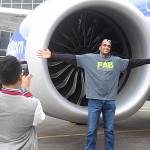 Ahron Goins, supply chain analyst at Boeing, poses in front of the 10,000th 737 airplane. Leah Abraham, Renton Reporter