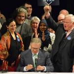 Gov. Jay Inslee signs package of bills at Foster High School