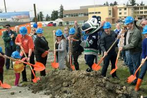 City leaders joined Dicks Drive-In owners, employees and customers, and Cool Bird, the Seattle Thunderbirds mascot, for an official groundbreaking ceremony on Tuesday for the new restaurant off Pacific Highway South on Kents West Hill. Story, page 2. MARK KLAAS, Kent Reporter