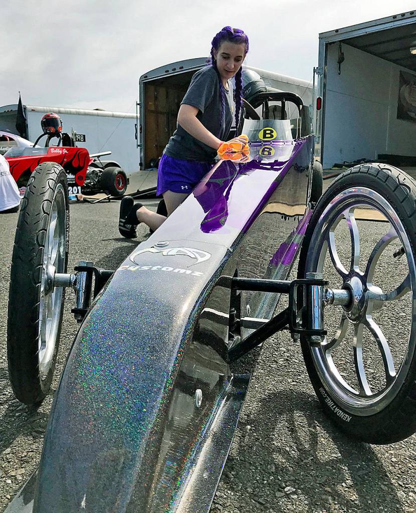 Jordan JoJo Dooley shines her purple Junior Dragster before qualifying at Pacific Raceways last Saturday. Dooley, 14, enjoys the sensation of speed and beating the competition, including the boys. MARK KLAAS, Kent Reporter