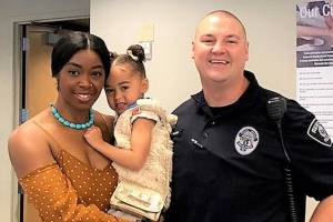 Officer Thaddeus Kerkhoff, right, with his wife Shari, left, and daughter Harlem. Photo courtesy Renton School District