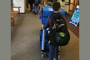 Students deliver breakfast to their classrooms as part of Cascade Elementarys Breakfast After the Bell program. Courtesy photo