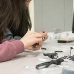Students examine the technology they will be using during their time at the Girls Exploring Tech camp at Renton Technical College. Photo by Kayse Angel