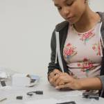 Isabella Gordon, a Risdon Middle School student, looks at some of the equipment that will be used during the Girls Exploring Tech camp at Renton Technical College. Photo by Kayse Angel