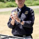 Brennan Phillips shows off a legal three-inch Aerial Salute firework. Used professionally, it has great effects during an Independence Day firework display; used by consumers, it can lead to lost limbs and even death. Photo by Ray Still