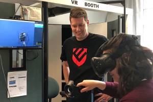 Eric Hougan, Central Washington University education professor, works with Kellie Dunne, junior at Hazen, to learn virtual reality during the Renton Teacher Academys trip to CWU. Courtesy photo