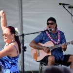 Headliner for Polynesian Festival Bruddah Waltah, who traveled from Hawaii to perform, plays while his wife of 43 years, Thailiana, dances on Saturday Aug. 18.