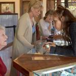 Evergreen cannabis educator Elan Gratix shows Connie some topical cannabis alternatives from smoking. Photos by Haley Ausbun.