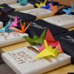 Photo by Haley Ausbun. The delegates received gifts from eight through 10th graders that included candies, origami cranes and hand-painted projects inspired by their visit.