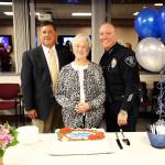 Mayor Denis Law, Police Chief Ed VanValey and his mother Jo Ann VanValey pose at the reception following his swearing in as new chief of police. Photo by Ava Van, City of Renton.