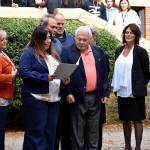 Renton High School principal Giovanna San Martin speaks before Mead receives his diploma.