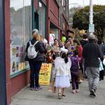 Crowds gathered throughout downtown to ask for candy from different local businesses.