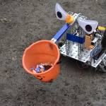 Bot Chad offers trick-or-treaters candies, courtesy of Hazen High Schools robotics team 8693.