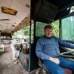 Charles Pillon sits inside one of the several buses on Iron Mountain. Photo by Caean Couto                                <em>Photo originally published <a href="www.rentonreporter.com/news/the-last-days-of-iron-mountain/" target="_blank">here</a></em>