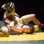 Erik Nguyen looks for nearfall on Kentwoods Spencer Hill at 106 pounds. Photo by Kayse Angel