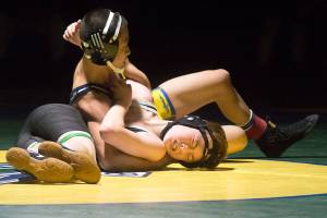 Erik Nguyen looks for nearfall on Kentwoods Spencer Hill at 106 pounds. Photo by Kayse Angel