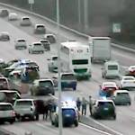 Law enforcement vehicles at the scene of a crash on I-5 near Northgate in Seattle after a chase that began in Lynnwood on Wednesday. (Washington State Department of Transportation)