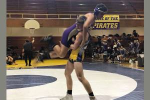 Conor McBride scores a takedown on his Highline opponent. Courtesy photo