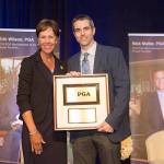 Photo by Hailey Garrett/PGA of America                                PGA of America President, Suzy Whaley and 2018 PGA Merchandiser of the Year Public Facilities recipient, Mark Rashell pose during the PGA Merchandiser of the Year Awards in Florida Jan. 19.