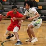 Senior guard Isaiah Little drives past his defender in the first half of Thursdays win over Foss. Photo by Sarah Brenden