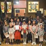 Youth essay winners and their teachers pose during the award ceremony at the Veterans of Foreign Wars Post No. 9430 in Skyway. Courtesy photo