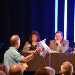 A man addresses the King County Council during a public hearing March 20 at New Life Church in Renton. He presented bags filled with what he said was hazardous materials dropped on his property by bald eagles. Another speaker made similar claims. Haley Ausbun/staff photo
