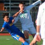 Senior Marc Nabong, left, dives for the ball Tuesday against a Kentwood Conqueror. Photos by Kayse Angel