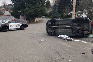 A vehicle driving erratically near Northeast 3rd and Bronson Way Northeast Thursday morning reportedly hit a vehicle backing out of their driveway and a parked car. Photos courtesy Renton Police Departments Facebook