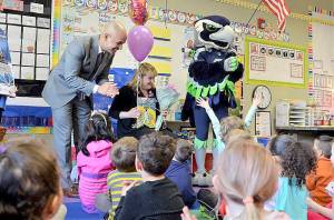 Photo courtesy Renton Schools Facebook page                                Tracy Dyson, from Hazelwood Elementary School, is one of the Renton Chamber of Commerces 2019 Ahead of the Class teachers. Renton Superintendent Dr. Damien Pattenaude and Blitz surprised Dyson April 3.