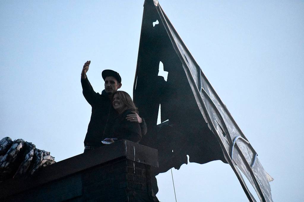Western Neons Dylan Neuwirth and Municipal Arts Commissions Marsha Rollinger had the honor of lighting the dragon during the unveiling. Photo by Haley Ausbun.