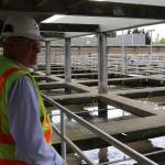 Jim Pitts stands on walkway overlooking filtration chambers at the King County South Treatment Plant in Renton. Aaron Kunkler/staff photo