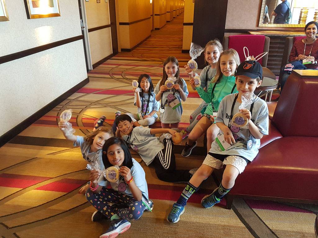 Courtesy photo. The Rockin Robots at the FIRST robotics championship in Houston, Texas. Not in order: Milla Fishler, Hunter Kemery, Noah Yoon, Emma Chang, Kara Strien, Neha Ram, Callie Graham and Elizabeth Strege.