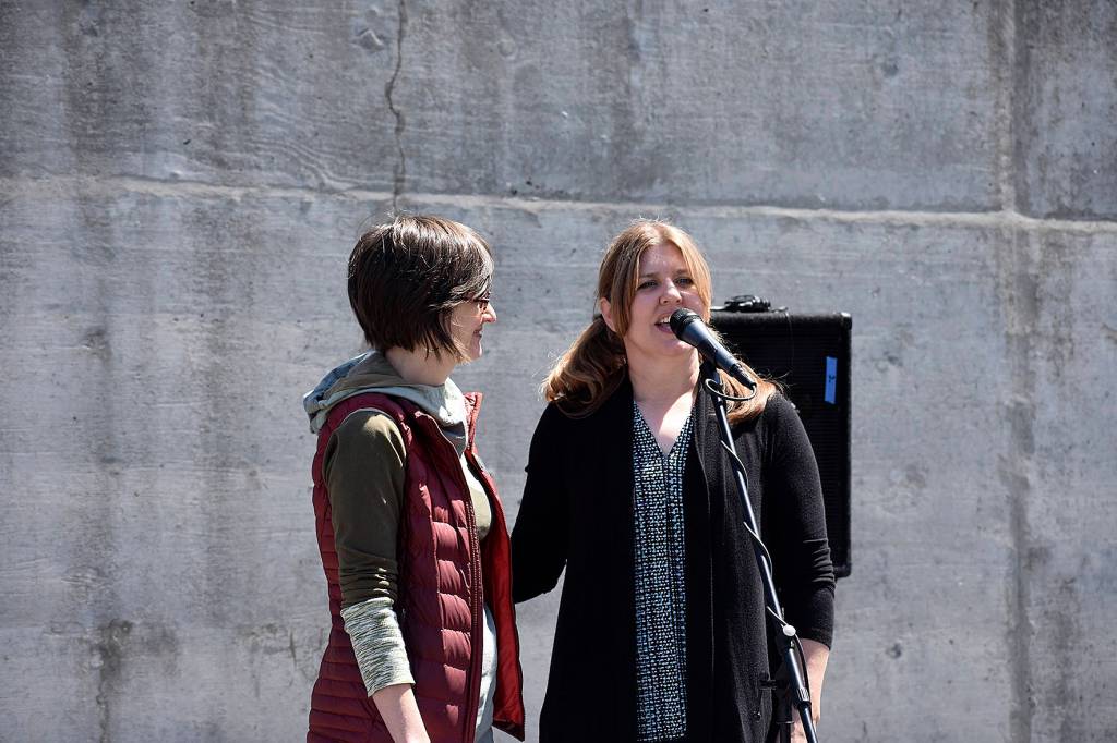 Photo by Haley Ausbun. MxM Creative, which is Renton Municipal Arts Commission members Mary Clymer and Marsha Rollinger, talking about working together on the Sunset fence project, at the dedication June 9 at Sunset Community Church.