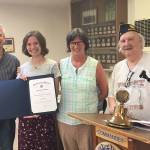 Photo courtesy of James Wilhoit                                Allison with her parents Steve and Sarah Rafert and Post Commander Bruce Welder.