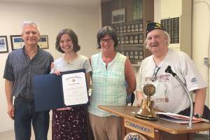 Photo courtesy of James Wilhoit                                Allison with her parents Steve and Sarah Rafert and Post Commander Bruce Welder.