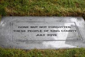 Photo by Haley Ausbun. Hundreds of people who passed away without family to bury them were remembered Wednesday, July 10, at the King County Medical Examiners Office Indigent Remains Ceremony at Mount Olivet Cemetery.