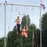 Olivia McPherson with another Wenatchee Youth Circus member up on the trapeze.
