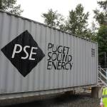 Puget Sound Energy product development manager John Dooley stands in front of one of four units at the Glacier Battery Storage Project in northwest Washington state. The project can provide power to the small town of Glacier for around two hours if needed. Aaron Kunkler/staff photo