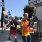 Grocery store union workers picket outside of a Renton Fred Meyers on July 31. They are in contract negotiations with Kroger for higher wages, predictable scheduling and better safety conditions. Haley Ausbun/staff photo