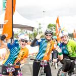Three friends and cyclists celebrate as they cross the finish line during the 2018 Obliteride event. Photo courtesy of Fred Hutch Obliteride.                                 Three friends and cyclists celebrate as they cross the finish line during the 2018 Obliteride event. Photo courtesy of Fred Hutch Obliteride.