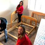 Courtesy of Marys Place. Volunteers from KeyBanks Hispanic-Latino Impact Networking Group and Key Womens Network gave a formerly homeless family everything they would need to start fresh in a new apartment through the Make-a-Home program.