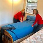 Courtesy of Marys Place. Volunteers from KeyBanks Hispanic-Latino Impact Networking Group and Key Womens Network gave a formerly homeless family everything they would need to start fresh in a new apartment through the Make-a-Home program.
