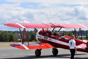 Photo by Haley Ausbun. Seniors in nearby care facilities took flight in a 1942 Boeing Stearman biplane at Renton Municipal Airport, offered by Ageless Aviation Dreams Foundation.