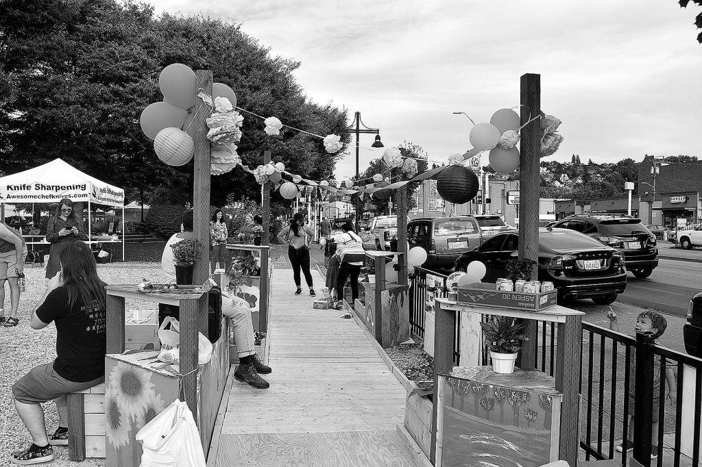 A new, temporary Pop-up Park gave Renton residents visiting the local farmers market a place to rest, or play, for a short-time.                                Photo by Haley Ausbun.