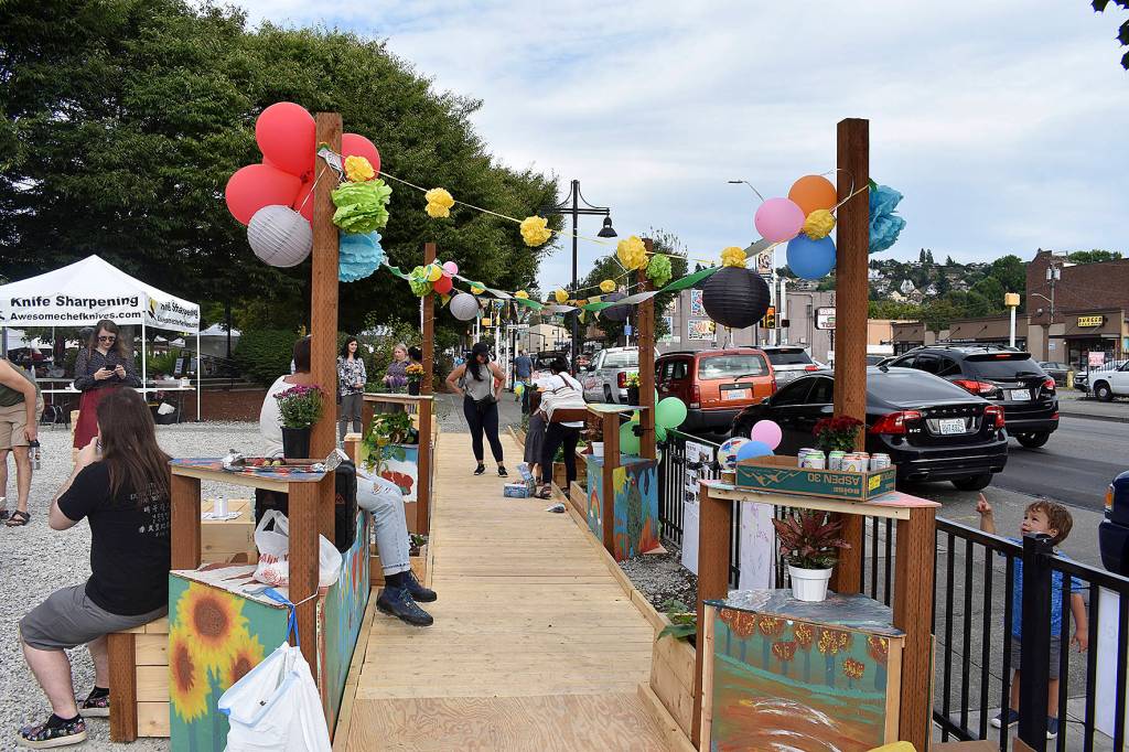 A new, temporary Pop-up Park gave Renton residents visiting the local farmers market a place to rest, or play, for a short-time.                                Photo by Haley Ausbun.