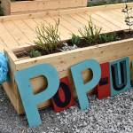 A new, temporary Pop-up Park gave Renton residents visiting the local farmers market a place to rest, or play, for a short-time.                                Photo by Haley Ausbun.
